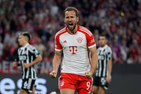 Harry Kane of Bayern Munich celebrates after scoring their sides third goal from the penalty spot during the UEFA Champions League match (Photo by Matthias Hangst/Getty Images) 