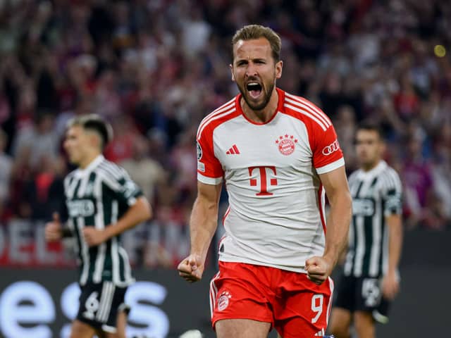  Harry Kane of Bayern Munich celebrates after scoring their sides third goal from the penalty spot during the UEFA Champions League match (Photo by Matthias Hangst/Getty Images) 