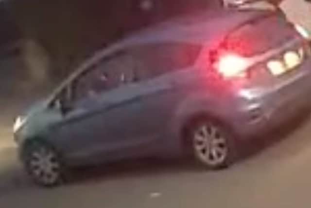 Ms Kelly and her two children were driven away in a blue Ford Fiesta