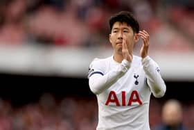 Heung-Min Son of Tottenham Hotspur applauds the fans after the draw during the Premier League match (Photo by Ryan Pierse/Getty Images)