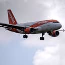 An easyJet aircraft comes in to land at Gatwick Airport. (Photo by Ben Stansall / AFP) (Photo by BEN STANSALL/AFP via Getty Images)