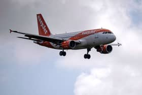 An easyJet aircraft comes in to land at Gatwick Airport. (Photo by Ben Stansall / AFP) (Photo by BEN STANSALL/AFP via Getty Images)