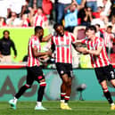  Ivan Toney of Brentford celebrates with Aaron Hickey and teammates after scoring the team’s first goal  (Photo by Clive Rose/Getty Images)