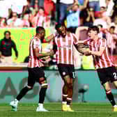  Ivan Toney of Brentford celebrates with Aaron Hickey and teammates after scoring the team’s first goal  (Photo by Clive Rose/Getty Images)