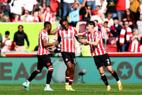  Ivan Toney of Brentford celebrates with Aaron Hickey and teammates after scoring the team’s first goal  (Photo by Clive Rose/Getty Images)