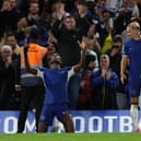 Nicolas Jackson celebrates scoring the opening goal with Chelsea's Ukrainian midfielder #10 Mykhailo Mudryk  (Photo by ADRIAN DENNIS/AFP via Getty Images)