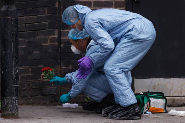 Police forensic officers at the scene. Credit: Dan Kitwood/Getty Images.