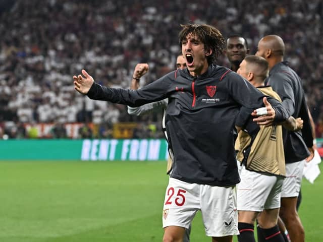 Sevilla players including Spanish forward Bryan Gil celebrate the 1-1 own goal during the UEFA Europa League final football match  (Photo by ATTILA KISBENEDEK/AFP via Getty Images)