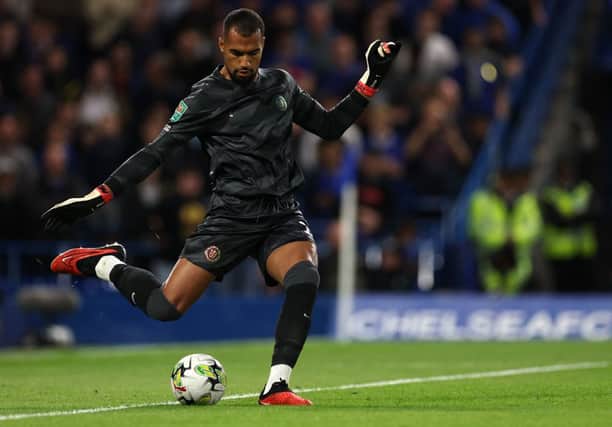Chelsea’s Spanish goalkeeper #01 Robert Sanchez takes a goal kick during the English League Cup third round (Photo by ADRIAN DENNIS/AFP via Getty Images)