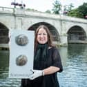 Tracey Lee holding ‘The Last Poo at the Zoo’, which was her first piece of animal poo-inspired art. Credit: Tracey Lee.