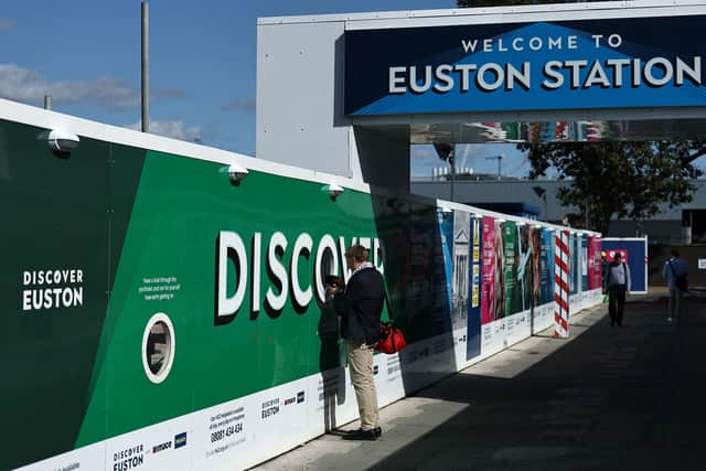 Work on HS2 has been ongoing at London Euston for years, with hoardings visible to those walking past. Credit: Henry Nicholls/AFP via Getty Images.