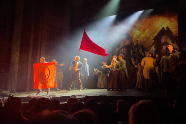 Just Stop Oil protesters on the stage of a Les Miserables performance at the Sondheim Theatre. Credit: Just Stop Oil