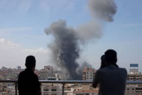 Smoke billows from a residential building following an Israeli airstrike in Gaza City on October 7, 2023. Credit: AFP via Getty Images