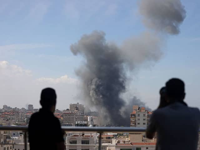 Smoke billows from a residential building following an Israeli airstrike in Gaza City on October 7, 2023. Credit: AFP via Getty Images