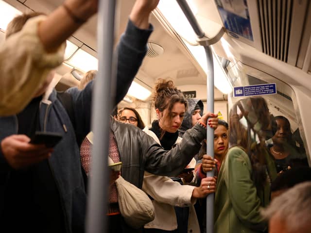 Commuters on a Piccadilly line train. Credit: Daniel Leal/AFP via Getty Images.