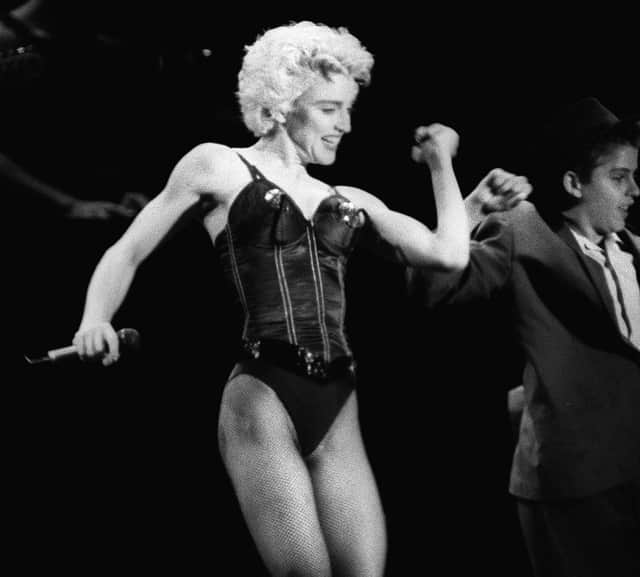 Madonna on stage in 1987. (Photo by BERTRAND GUAY/AFP via Getty Images)