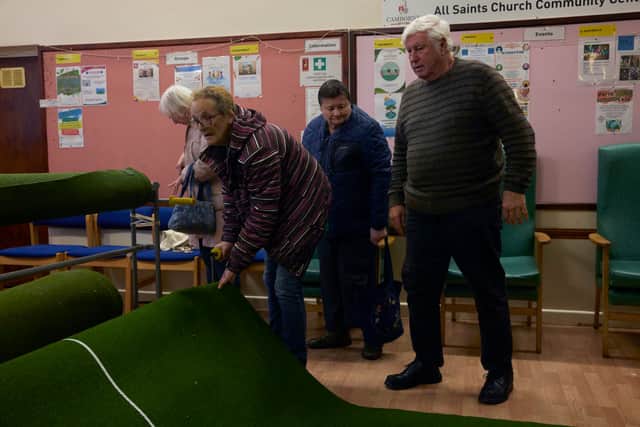 A group of pensioners attending a warm bank