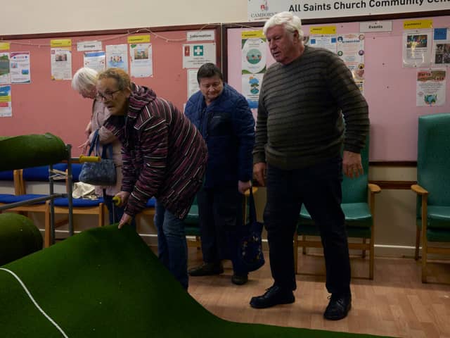 A group of pensioners attending a warm bank 