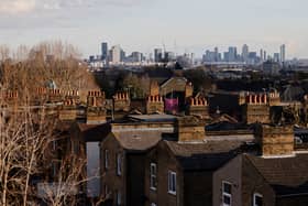 Homes in Walthamstow, with the City of London in the distance. (Photo by Tolga Akmen / AFP via Getty Images)