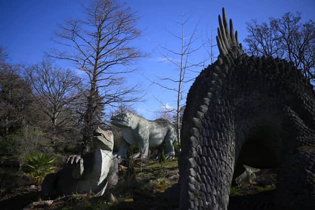 The dinosaurs are a major attraction for visitors to Crystal Palace Park. Credit: Daniel Leal/AFP via Getty Images.