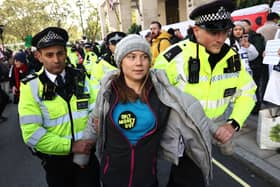 Greta Thunberg has been charged after attending a protest outside the Energy Intelligence Forum. Credit: Henry Nicholls/AFP via Getty Images.