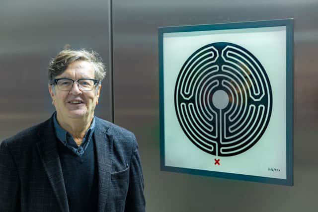 Artist Mark Wallinger with the new Labyrinth artwork at Battersea Power Station Tube stop. Credit: TfL.