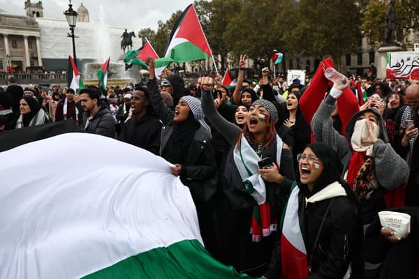 An estimated 100,000 people took part in the pro-Palestine march in London on October 21. Credit: Henry Nicholls/AFP via Getty Images.