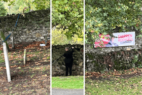 A 'Darren Rodwell for Barking' banner was hung by being attached to gravestones. (Photo by Matt Lismore)