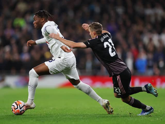 Destiny Udogie of Tottenham Hotspur runs with the ball whilst under pressure from Timothy Castagne of Fulham. (Photo by Alex Pantling/Getty Images)