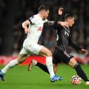 Sasa Lukic of Fulham runs with the ball whilst under pressure from Pierre-Emile Hojbjerg of Tottenham  (Photo by Justin Setterfield/Getty Images)