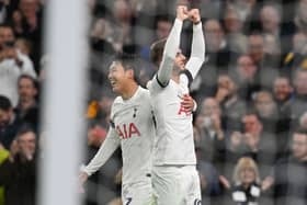 Tottenham Hotspur’s English midfielder #10 James Maddison (R) celebrates with Tottenham Hotspur’s South Korean striker   (Photo by GLYN KIRK/AFP via Getty Images)