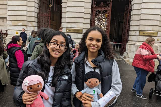 School friends Elayza, 13  (left) and Uli, 12 (right) came to the demonstration wearing their names sellotaped to their arms.