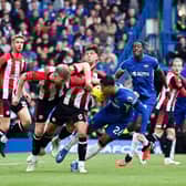 Brentford’s Scottish defender #02 Aaron Hickey (3L) and Chelsea’s English defender #26 Levi Colwill (C) compete for the ball  (Photo by JUSTIN TALLIS/AFP via Getty Images)