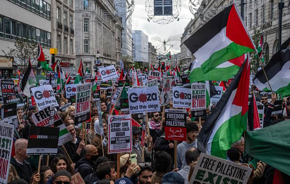People take part in a demonstration in support of Palestine on October 14, 2023 in London, United Kingdom. 