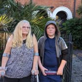 Rosemary Boden and her grandson outside her temporary accommodation in Lower Addiscombe. (Photo by Harrison Galliven)