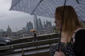 Heavy rain over Waterloo Bridge in July 2023. (Photo by Dan Kitwood/Getty Images)