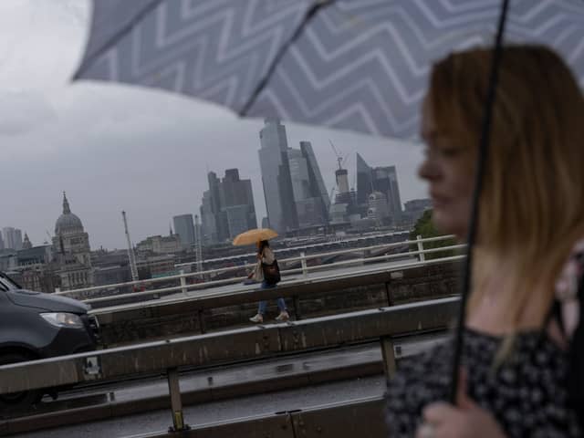 Heavy rain over Waterloo Bridge in July 2023. (Photo by Dan Kitwood/Getty Images)