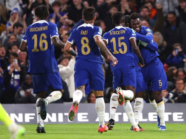 Benoit Badiashile of Chelsea celebrates with teammates after scoring the team's first goal during the Carabao  (Photo by Clive Rose/Getty Images)