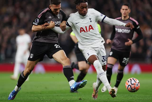 Destiny Udogie of Tottenham Hotspur battles for possession with Joao Palhinha of Fulham during the Premier League match (Photo by Alex Pantling/Getty Images)