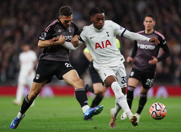 Destiny Udogie of Tottenham Hotspur battles for possession with Joao Palhinha of Fulham during the Premier League match (Photo by Alex Pantling/Getty Images)