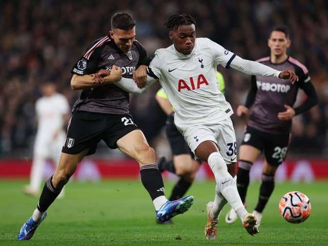 Destiny Udogie of Tottenham Hotspur battles for possession with Joao Palhinha of Fulham during the Premier League match (Photo by Alex Pantling/Getty Images)