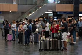 People wait for trains at Euston station in June 2022. (Photo by Carl Court/Getty Images)