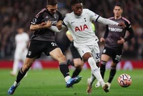 Destiny Udogie of Tottenham Hotspur battles for possession with Joao Palhinha of Fulham during the Premier League match (Photo by Alex Pantling/Getty Images)