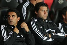   Manager Mauricio Pochettino (R) of Southampton and assistant manager Jesus Perez look on  (Photo by Ian Walton/Getty Images)