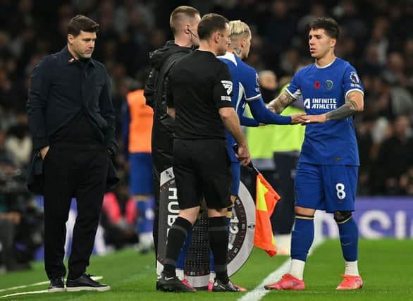 Chelsea's Argentinian head coach Mauricio Pochettino (L) watches as Chelsea's Argentinian midfielder #08 Enzo Fernandez  (Photo by GLYN KIRK/AFP via Getty Images)