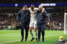 Micky van de Ven of Tottenham Hotspur is substituted after going down with an injury during