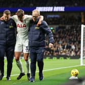 Micky van de Ven of Tottenham Hotspur is substituted after going down with an injury during the Premier League match 