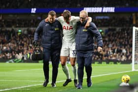 Micky van de Ven of Tottenham Hotspur is substituted after going down with an injury during the Premier League match 