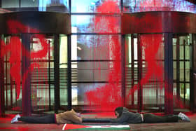 Activists from Palestine Action lock themselves together outside the Thales' London headquarters
