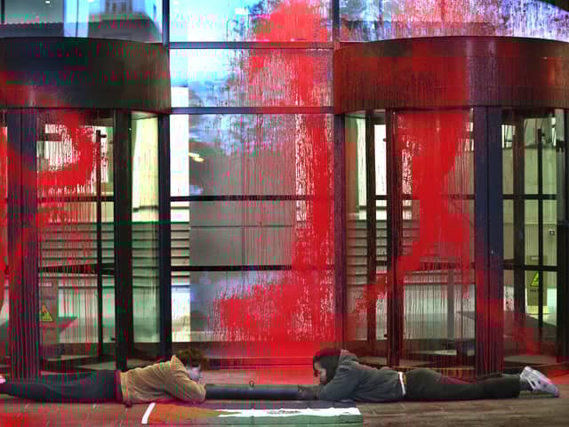 Activists from Palestine Action lock themselves together outside the Thales' London headquarters
